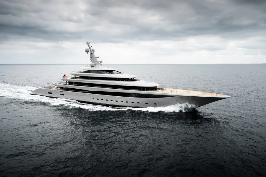 The 102.4 metre Lürssen motor yacht NIXIE under way beneath a grey sky